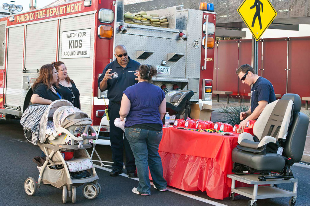 Phoenix firefighters at a child safety seat event