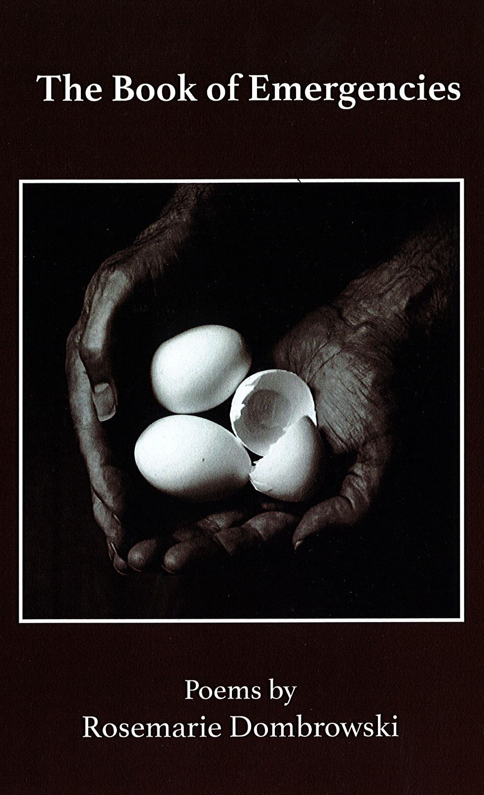 Cover of The Book of emergencies: Hands holding egg shells, one broken
