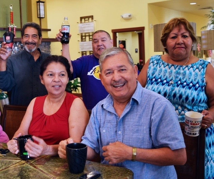 Residents drinking coffee and smiling 