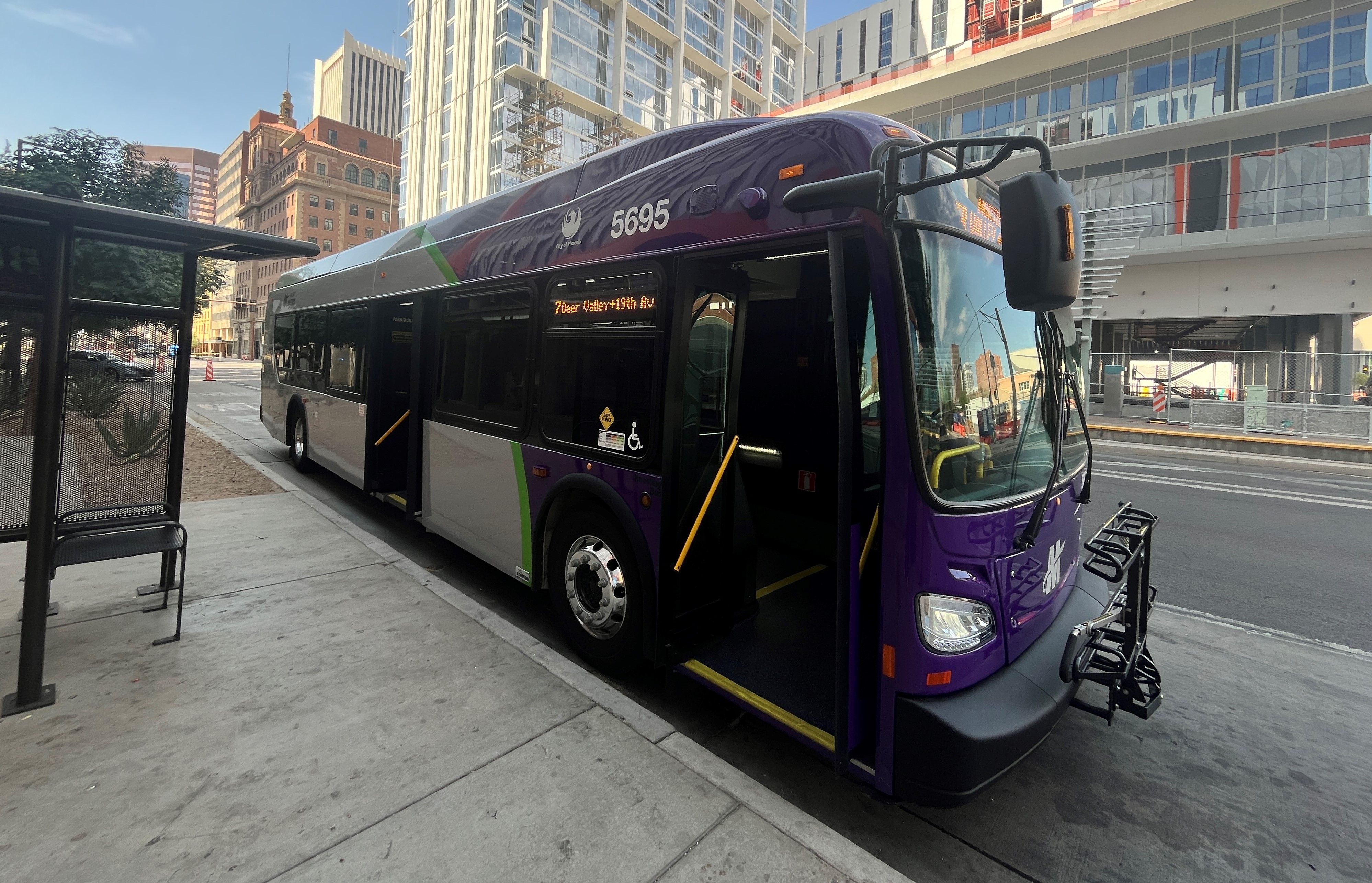 New Phoenix hybrid-electric bus, stopped by a shaded bus stop on Central Avenue in Downtown Phoenix. 