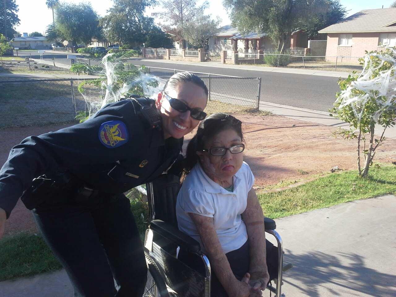 Girl with officer - 400 wheelchair